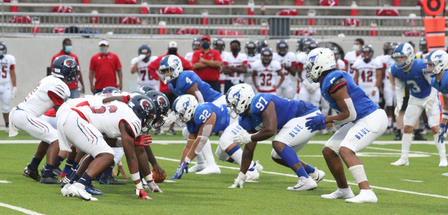 Marcus Daniels (4) and Jordan Daniels (5) lineup on the ends of the defensive front line for Taylor during a game against Cy-Springs on Sept. 24 at Legacy Stadium.